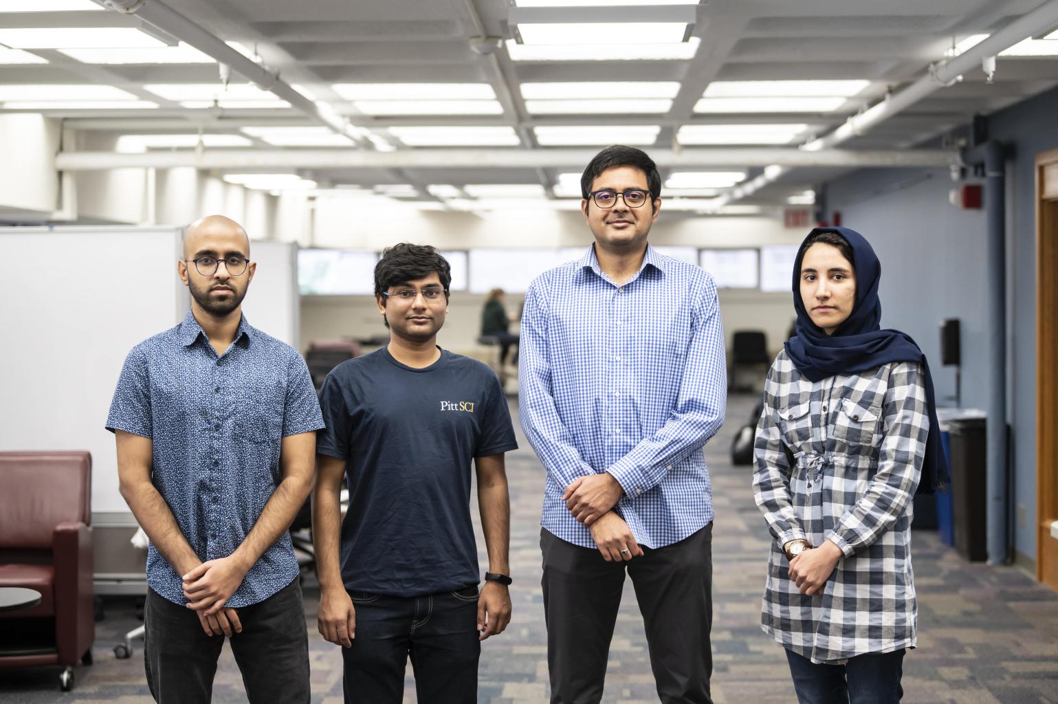 "The Quantum Information and Networking group led by Dr. Kaushik Seshadreesan. From the left, Vivek Kumar, Nitish Kumar Chandra, Dr. Seshadressan, and Mohadeseh Azari."